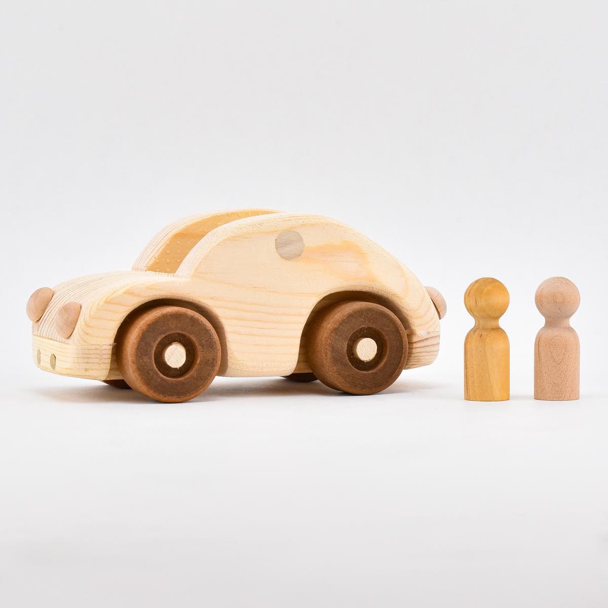 Liewood Dorte Wooden Toy Car in soft colors on a wooden surface