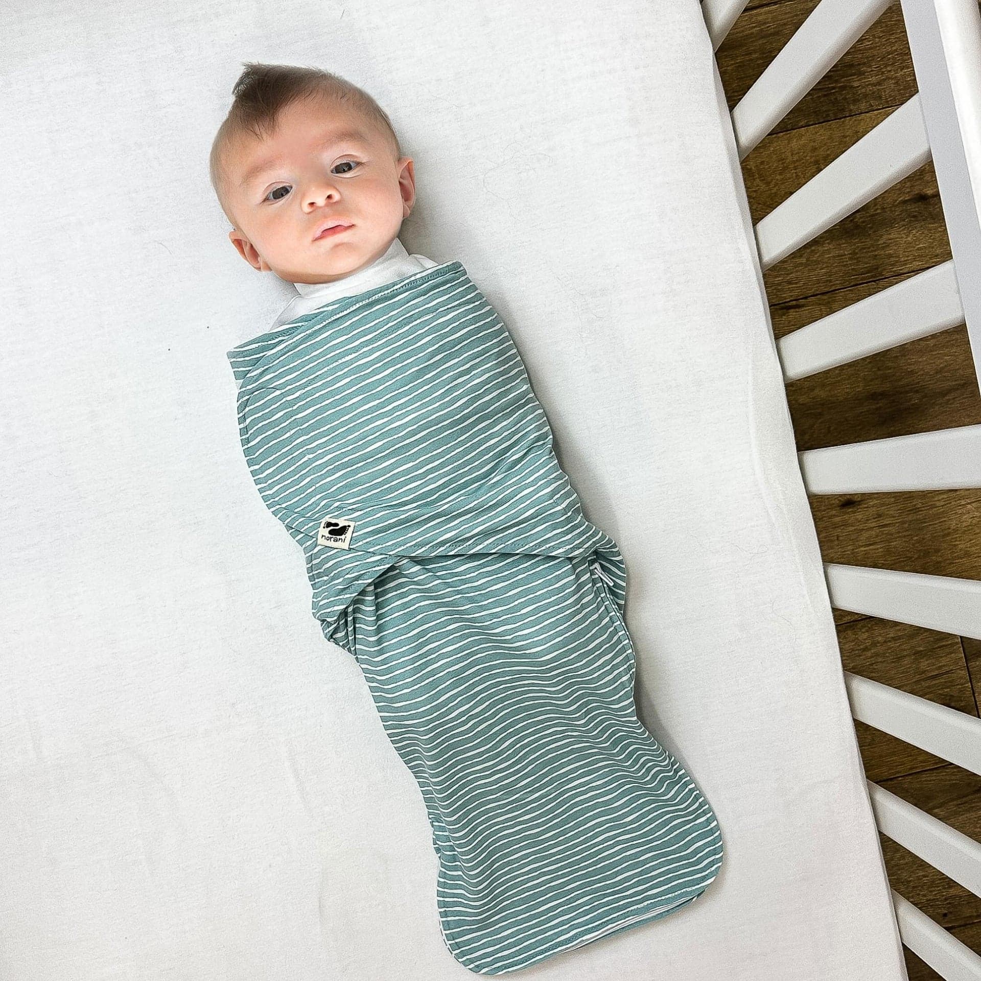 Snugababe Swaddle™ Sleep Pod in green stripes by Norani Baby.