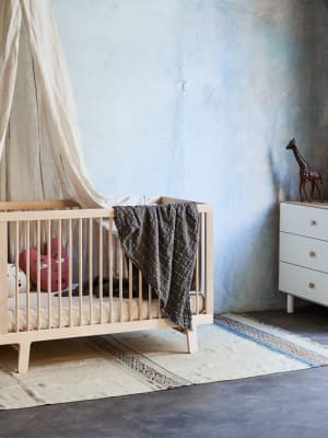 Oeuf Sparrow Crib in a modern nursery setting.