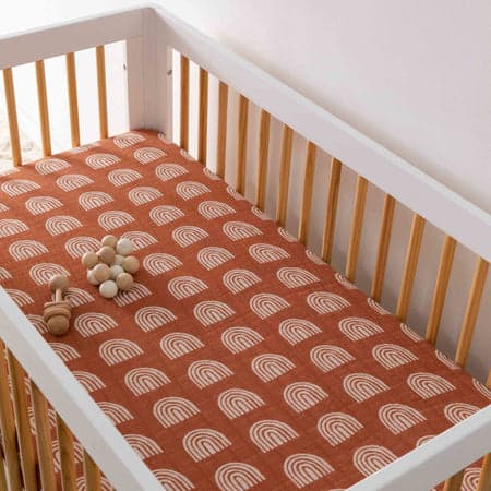 Babyletto Crib Sheet in GOTS Certified Organic Muslin Cotton on a crib.
