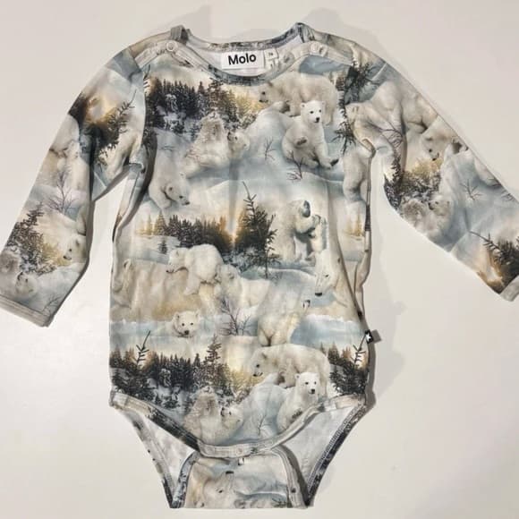 Molo Polar Bear Bodysuit for babies, showcasing a playful polar bear print.