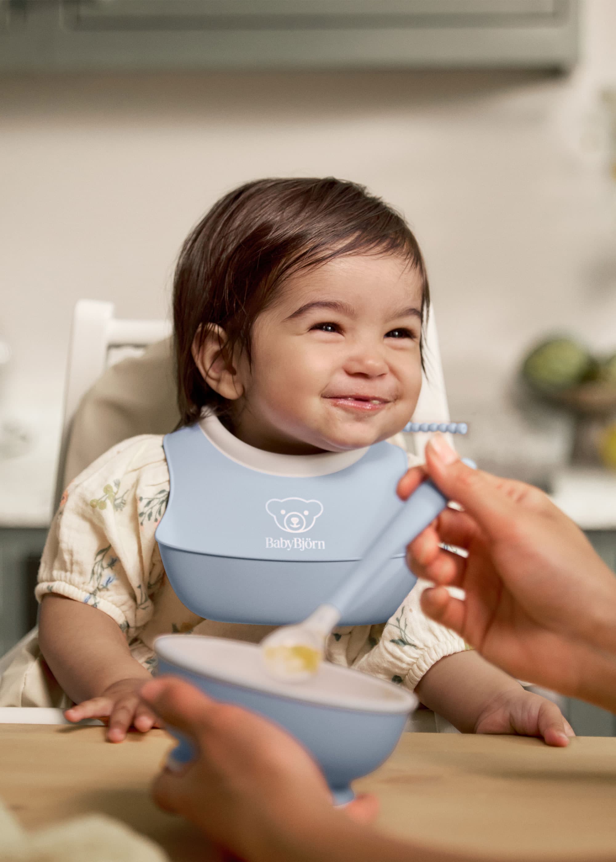 BabyBjörn Baby Feeding Set with colorful plates and utensils