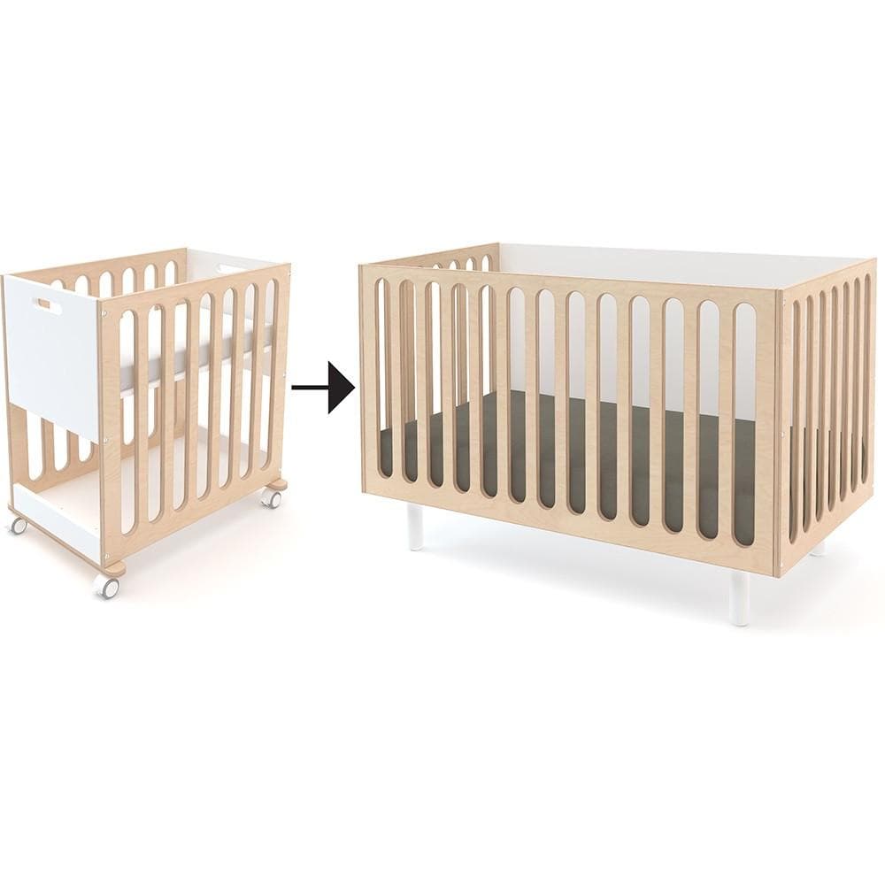 Oeuf Fawn Crib & Bassinet System in a stylish nursery setting.