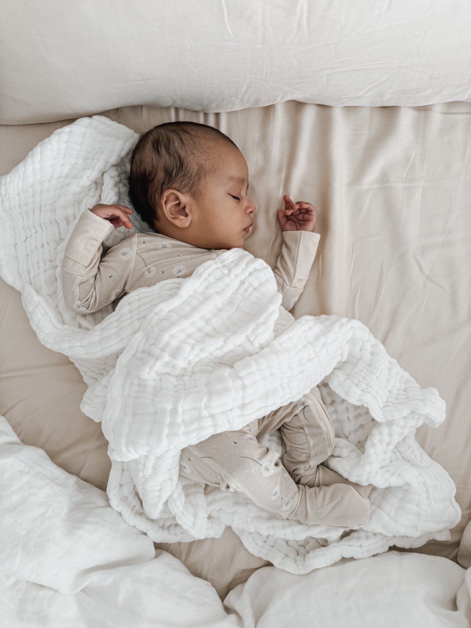 Luna + Luca Cotton Gauze Baby Blanket in white, soft and breathable.