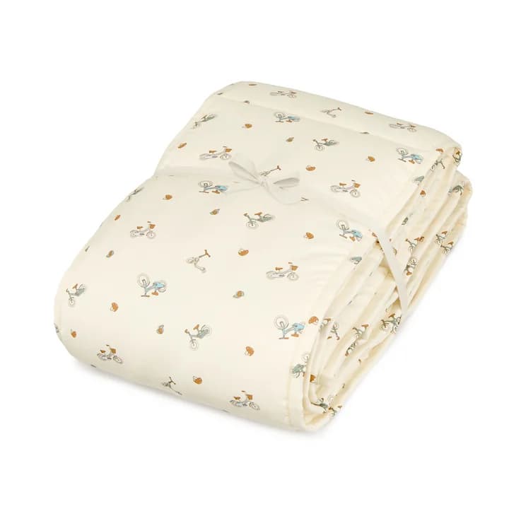 Cam Cam Copenhagen baby crib bed surround with bicycles design.