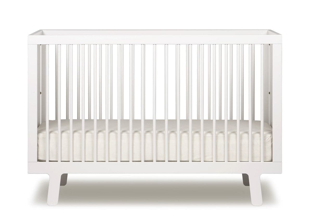Elegant Baby Crib Sparrow by Oeuf in natural wood finish.