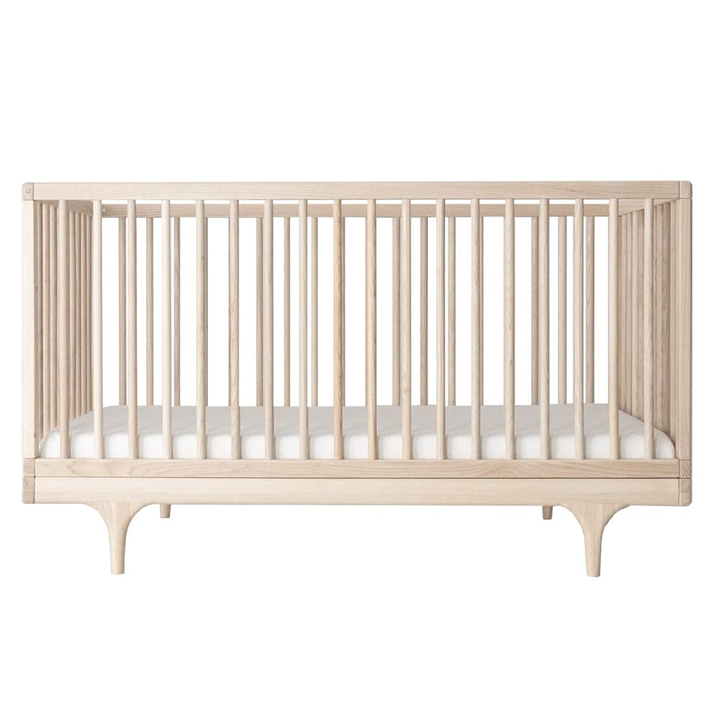 Kalon Caravan Crib in a modern nursery setting.
