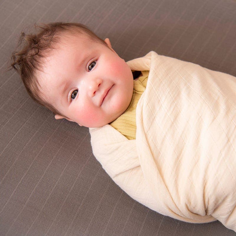 Naturepedic Organic Breathable Swaddle Blankets in four colors.